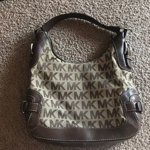 Michael Korrs tan hobo bag.